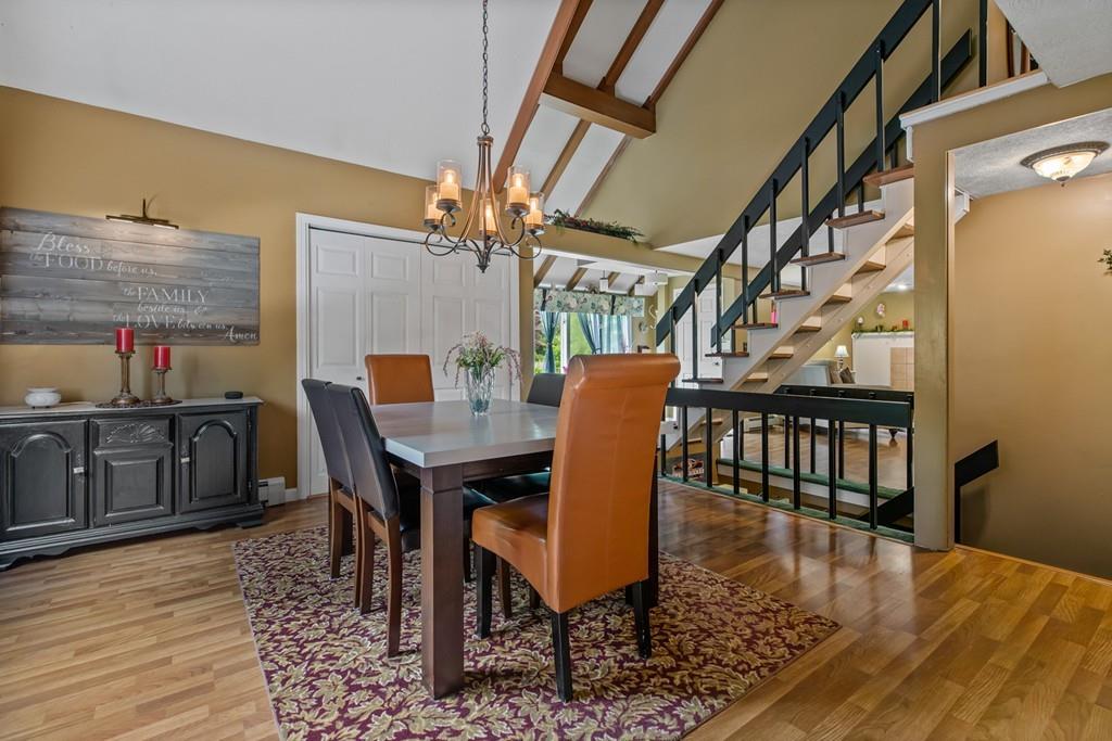 33 R F Higgins Drive Norwell, MA 02061 - Photo 9 of 34 a dining room with furniture and wooden floor