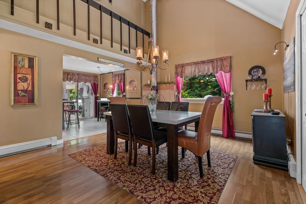 33 R F Higgins Drive Norwell, MA 02061 - Photo 10 of 34 a view of a dining room with furniture and wooden floor