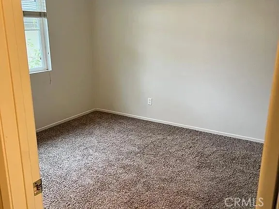 an empty room with a bench