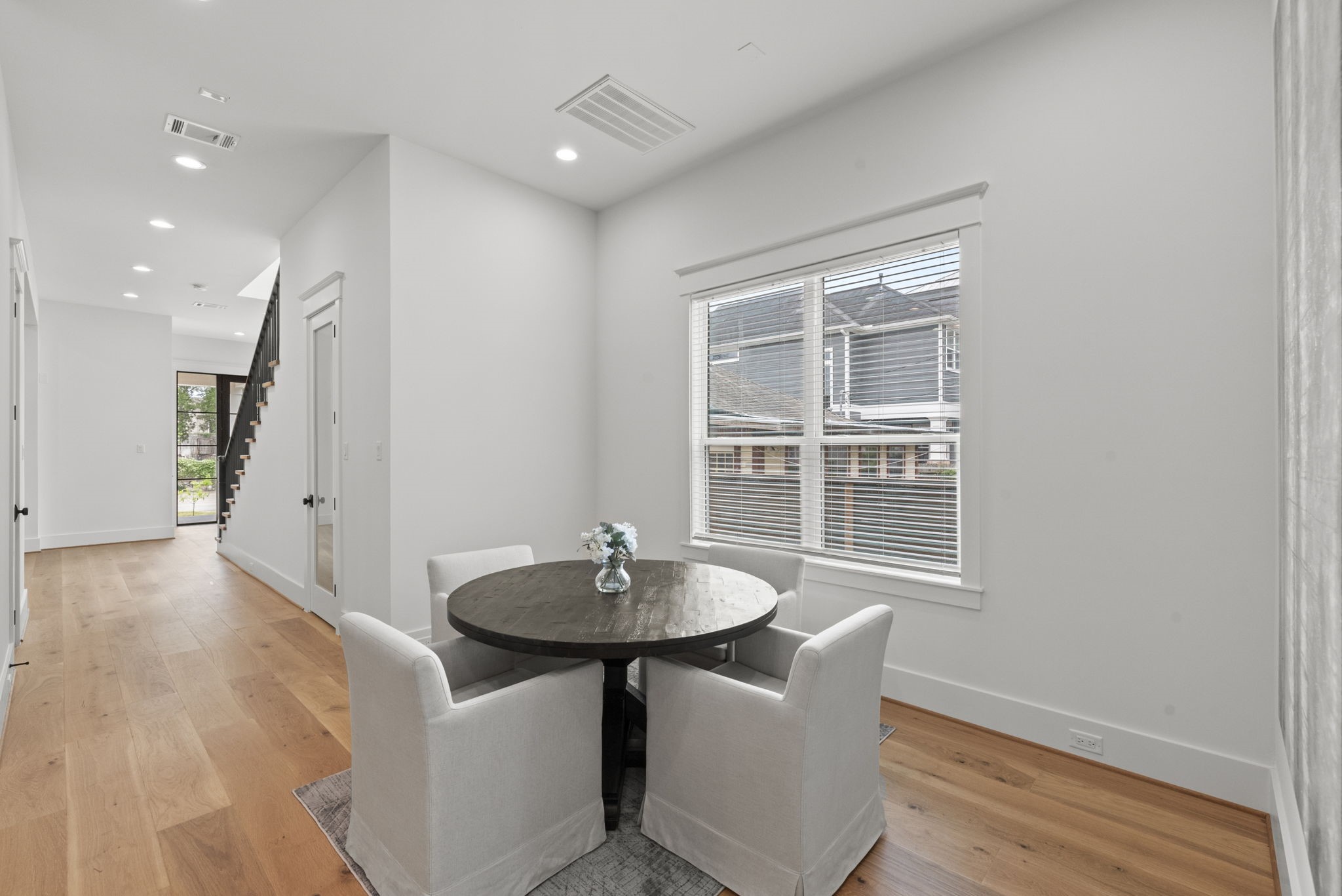 1315 Waverly Street Houston, TX 77008 - Photo 12 of 40 a view of a dining room with furniture window and wooden floor