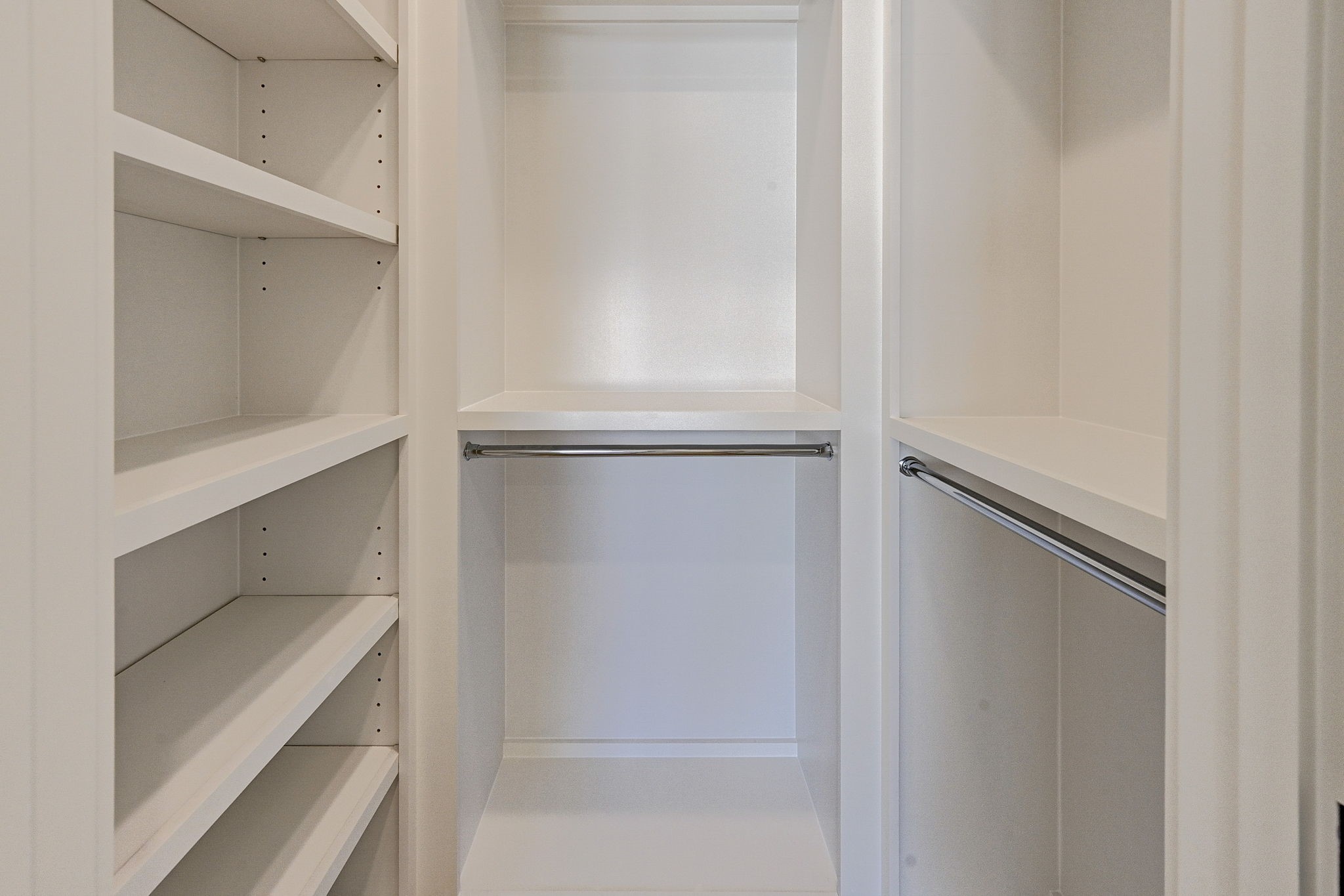 1315 Waverly Street Houston, TX 77008 - Photo 37 of 40 a view of walk in closet with empty racks