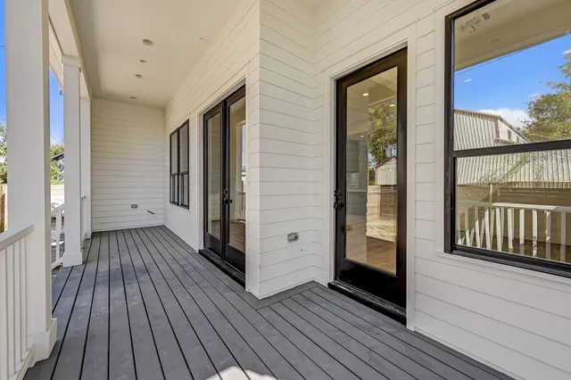 a view of a balcony with wooden floor