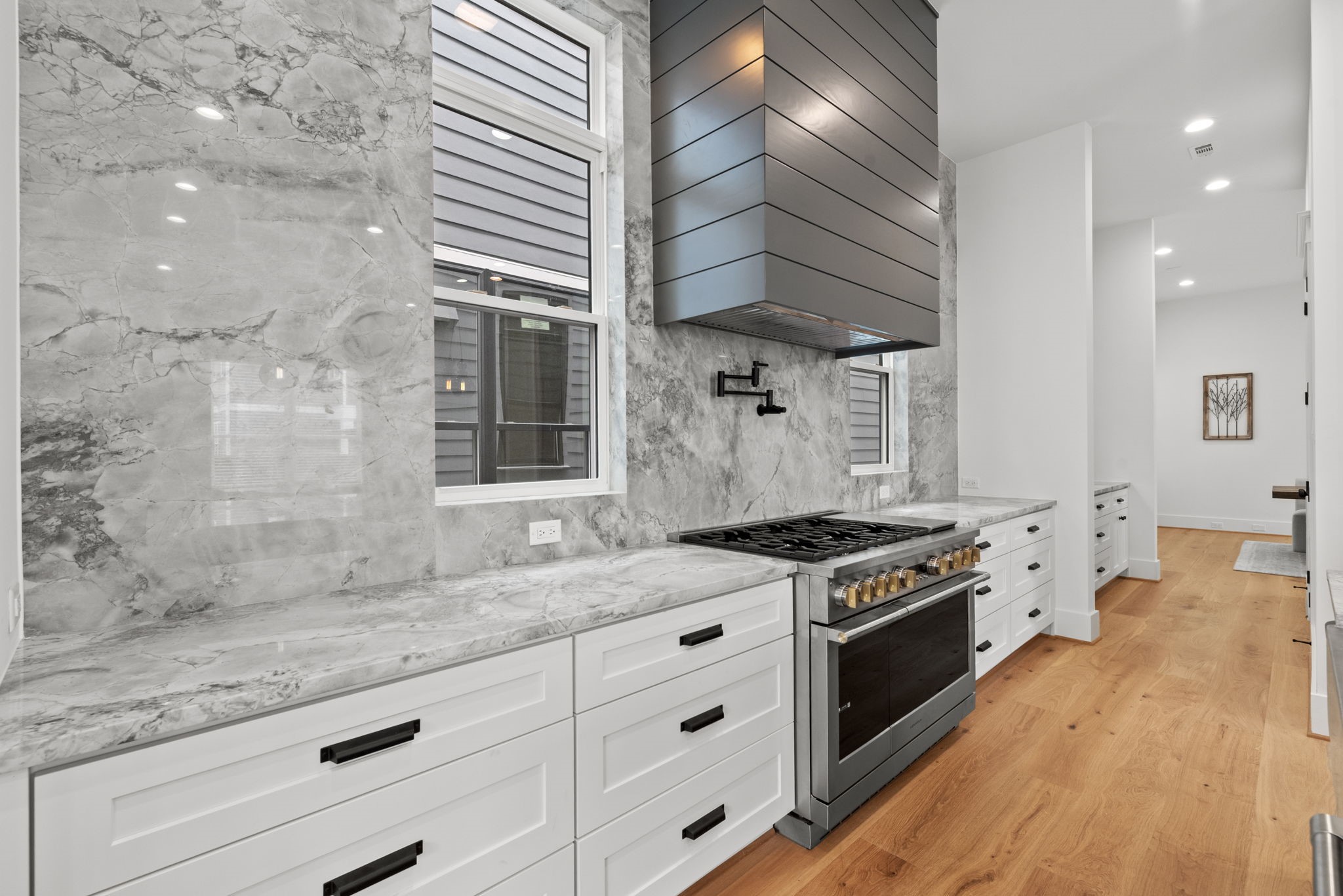 1315 Waverly Street Houston, TX 77008 - Photo 8 of 40 a kitchen with stainless steel appliances granite countertop a stove and a sink