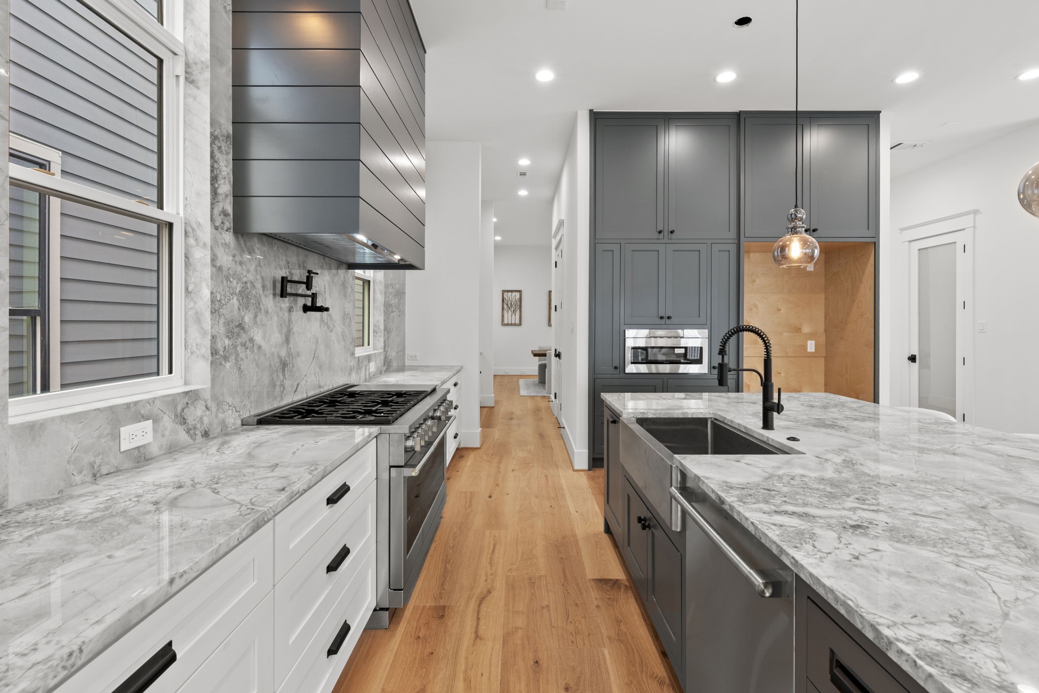 1315 Waverly Street Houston, TX 77008 - Photo 10 of 40 a large kitchen with stainless steel appliances granite countertop a lot of counter space and a sink