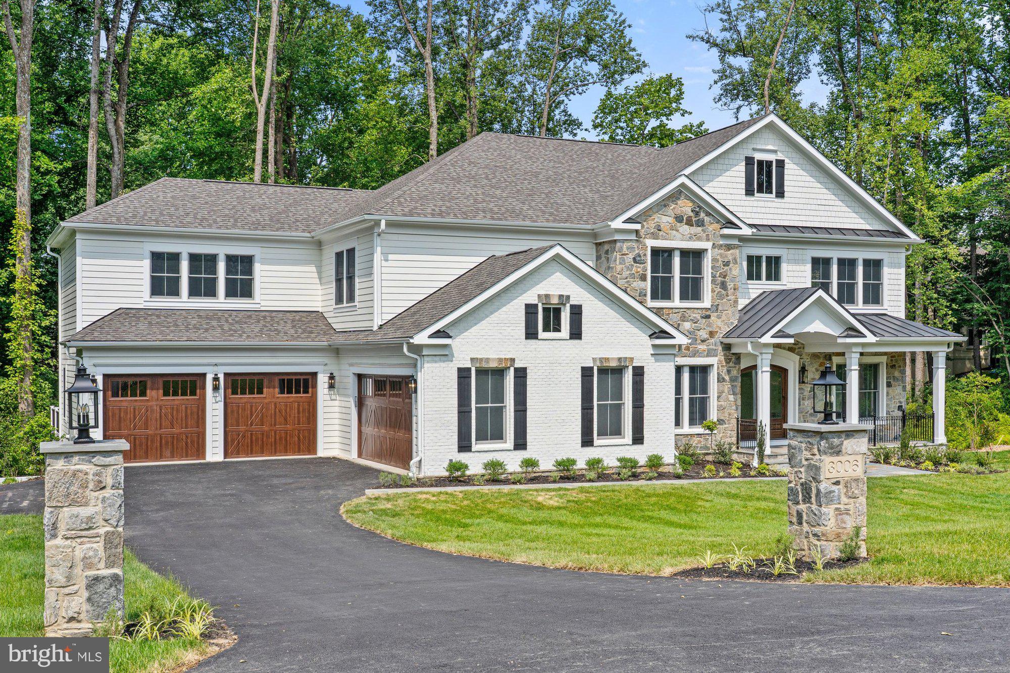 front view of a house next to a yard