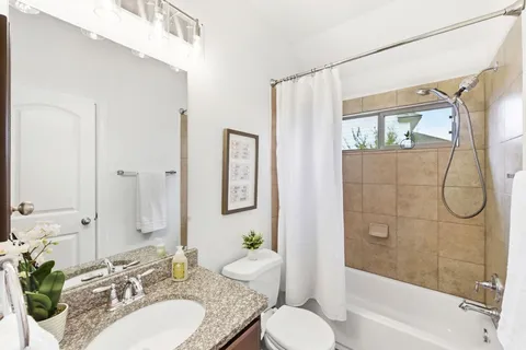 a bedroom with a bed and a chair