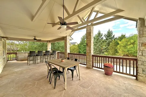 a bathroom with a granite countertop sink mirror and vanity