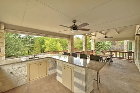 a dining room with furniture and a floor to ceiling window