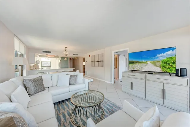 a kitchen with stainless steel appliances granite countertop a refrigerator a stove top oven a sink and dishwasher