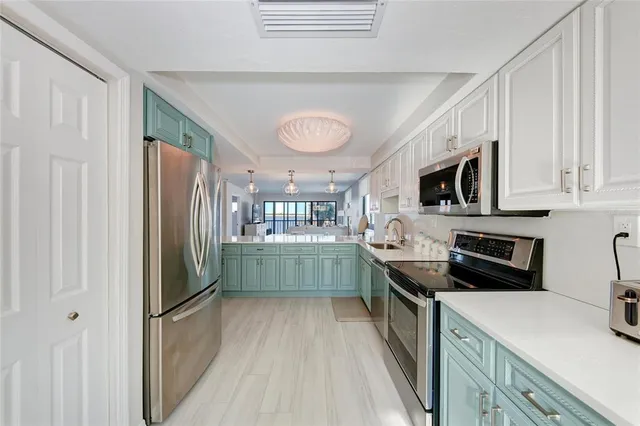 a view of a kitchen and a sink