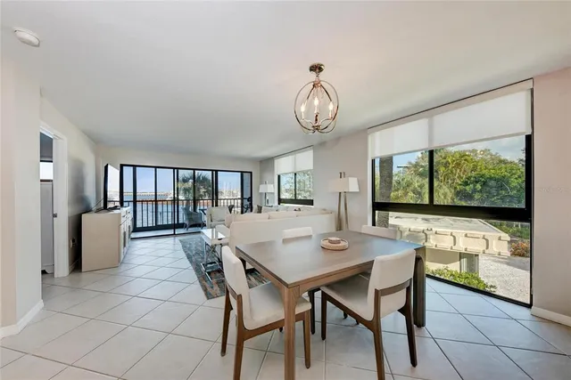a bedroom with a large bed and a large window