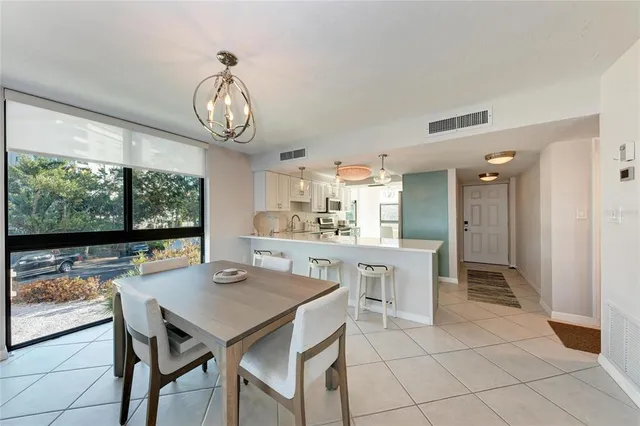 a bedroom with a large bed and a large window