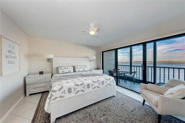 a spacious bathroom with a sink a toilet and a large mirror