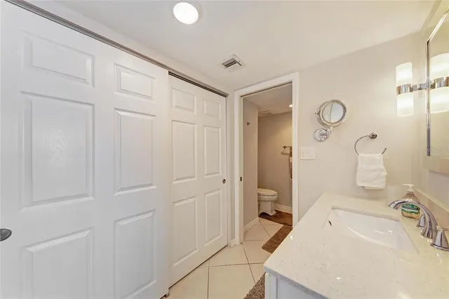 a bedroom with a bed and a cabinets