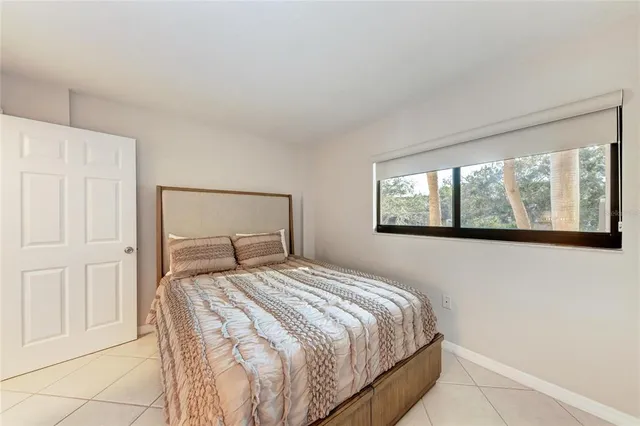 a balcony with furniture and wooden floor
