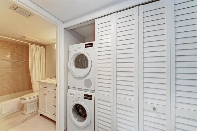 a sign board with a play ground in the back