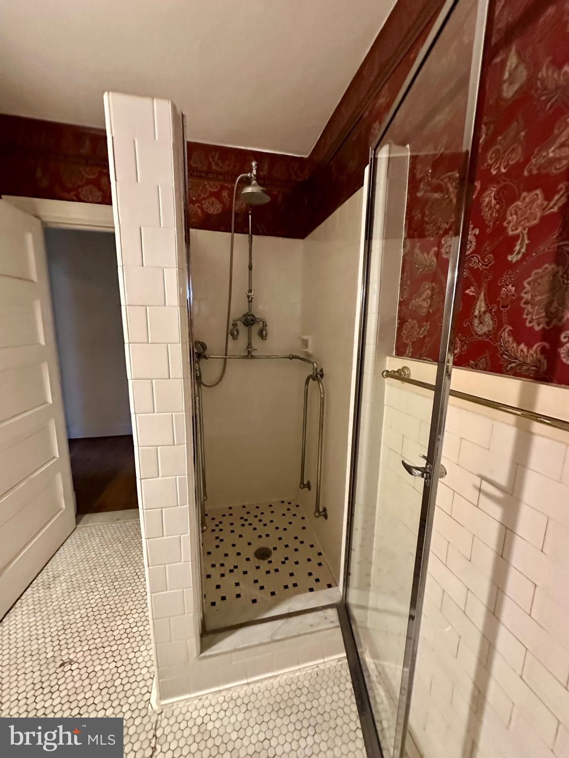 112 Elmhurst Road Baltimore, MD 21210 - Photo 15 of 29 a bathroom with a glass door shower and toilet