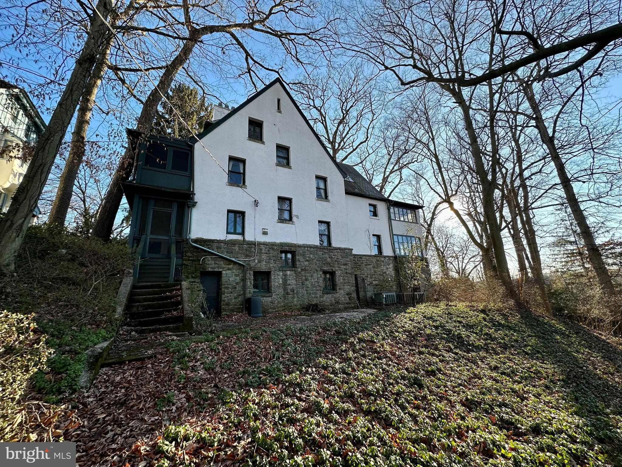112 Elmhurst Road Baltimore, MD 21210 - Photo 3 of 29 a view of a white house with a large tree