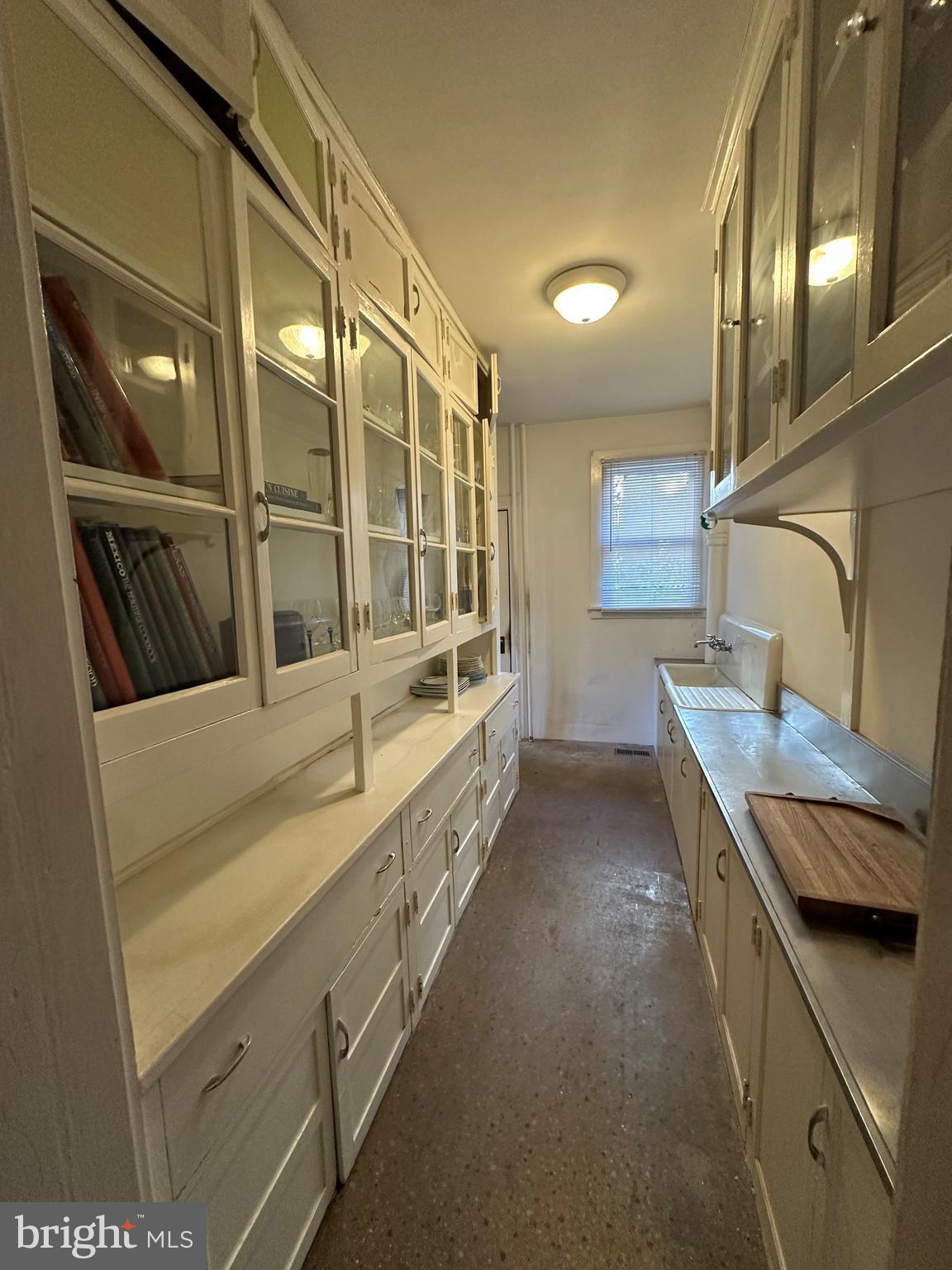 112 Elmhurst Road Baltimore, MD 21210 - Photo 6 of 29 a bathroom with a granite countertop double vanity and a large window