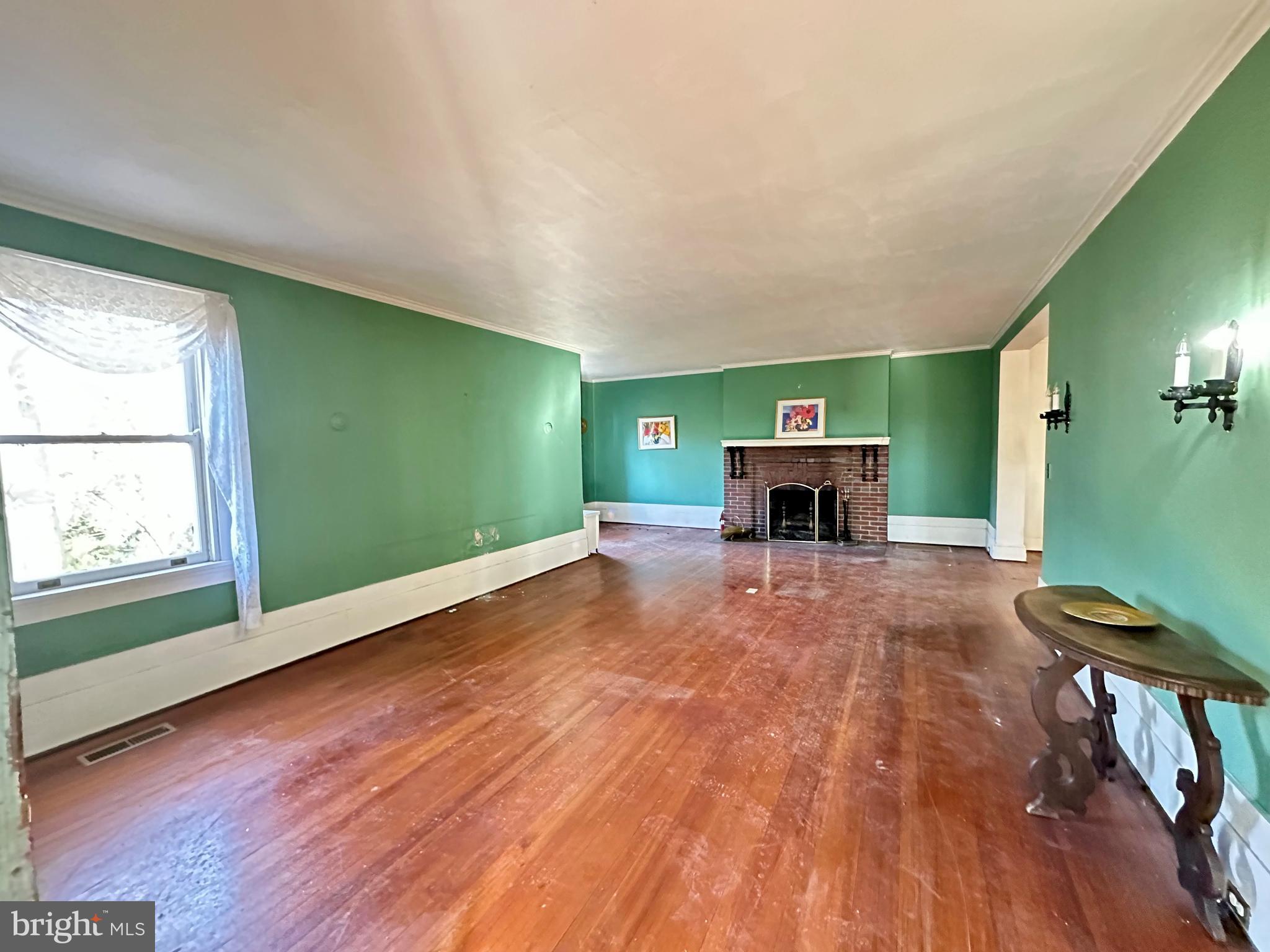 112 Elmhurst Road Baltimore, MD 21210 - Photo 8 of 29 a room with window and fireplace