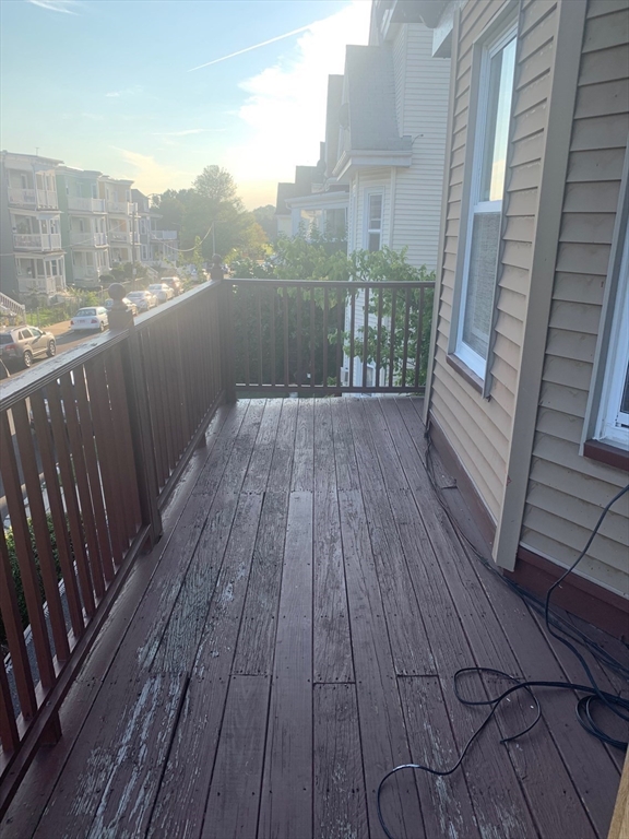 9 Kerwin Street, Unit 2 Boston, MA 02124 - Photo 11 of 13 a view of a balcony with wooden floor