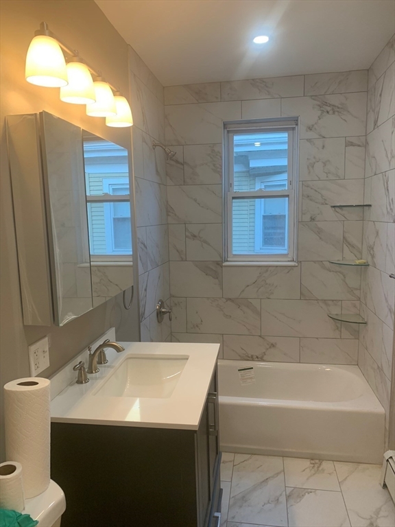 9 Kerwin Street, Unit 2 Boston, MA 02124 - Photo 10 of 13 a bathroom with a sink and a bathtub