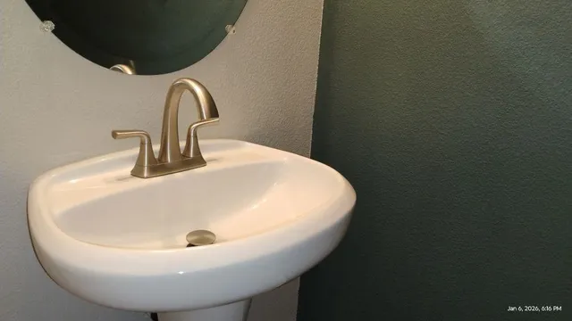 a white bath tub sitting next to a white toilet