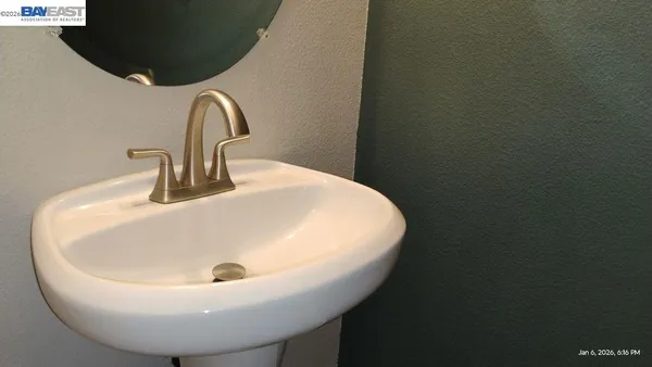 a white bath tub sitting next to a white toilet