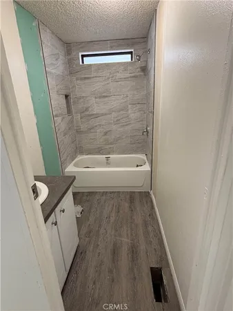 a bathroom with a sink a toilet and a shower