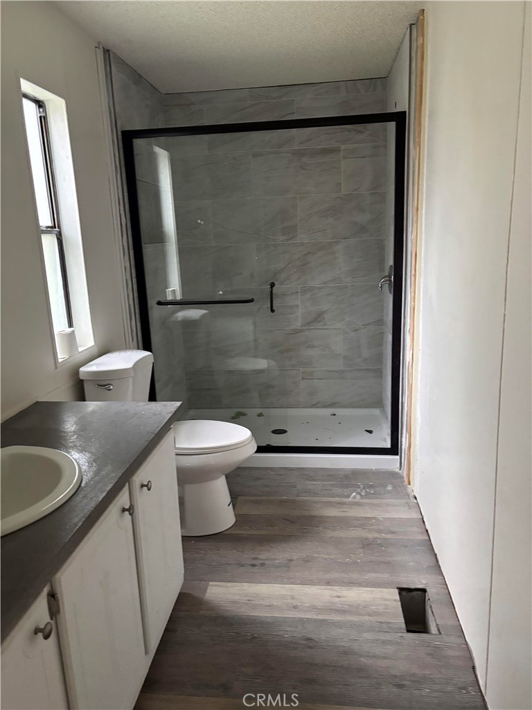 2720 Lebec Oaks Road Lebec, CA 93243 - Photo 4 of 4 a bathroom with a granite countertop sink toilet and shower