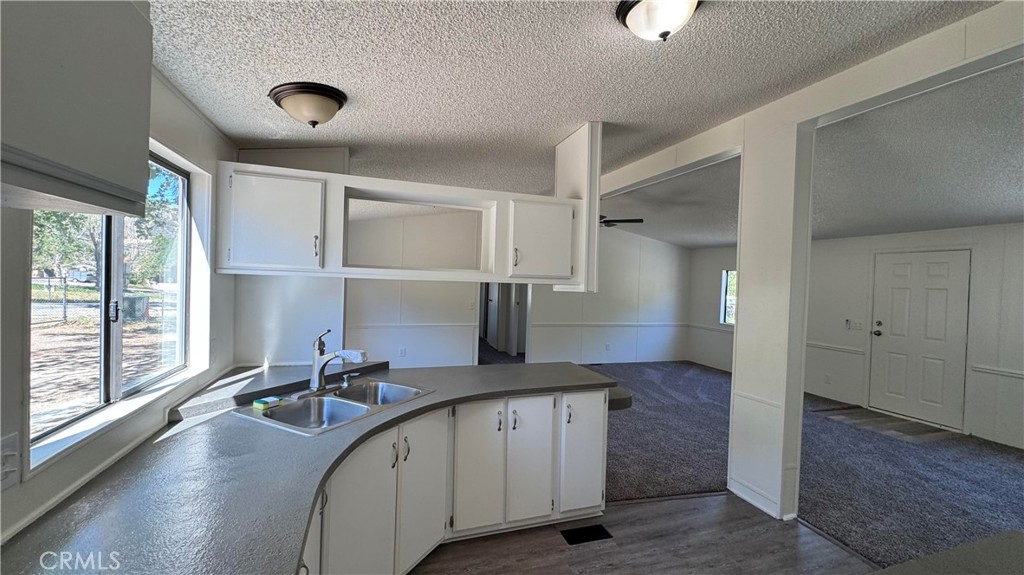 2720 Lebec Oaks Road Lebec, CA 93243 - Photo 6 of 24 a hallway with sink and mirror