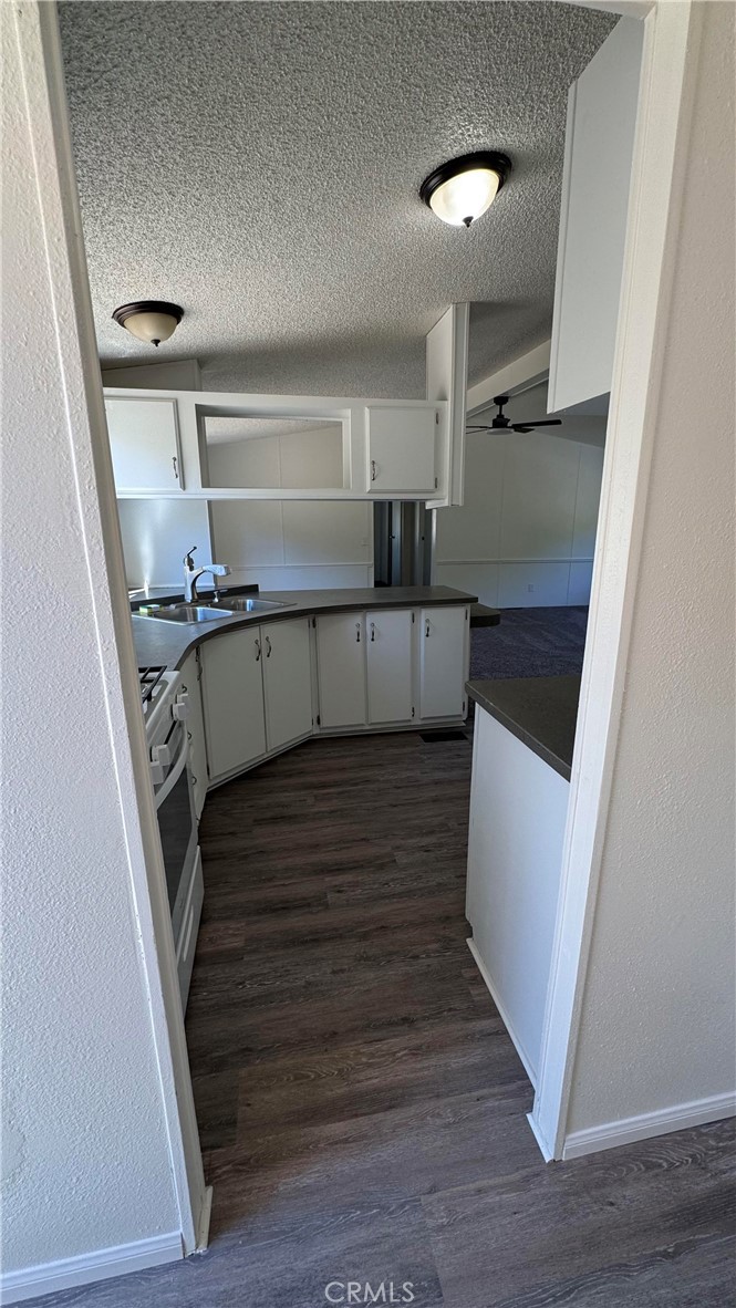 2720 Lebec Oaks Road Lebec, CA 93243 - Photo 7 of 24 a view of entryway and kitchen with wooden floor
