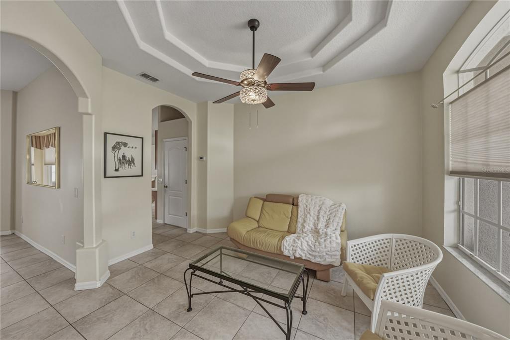 1542 Swamp Rose Lane Trinity, FL 34655 - Photo 19 of 64 a living room with furniture and a window