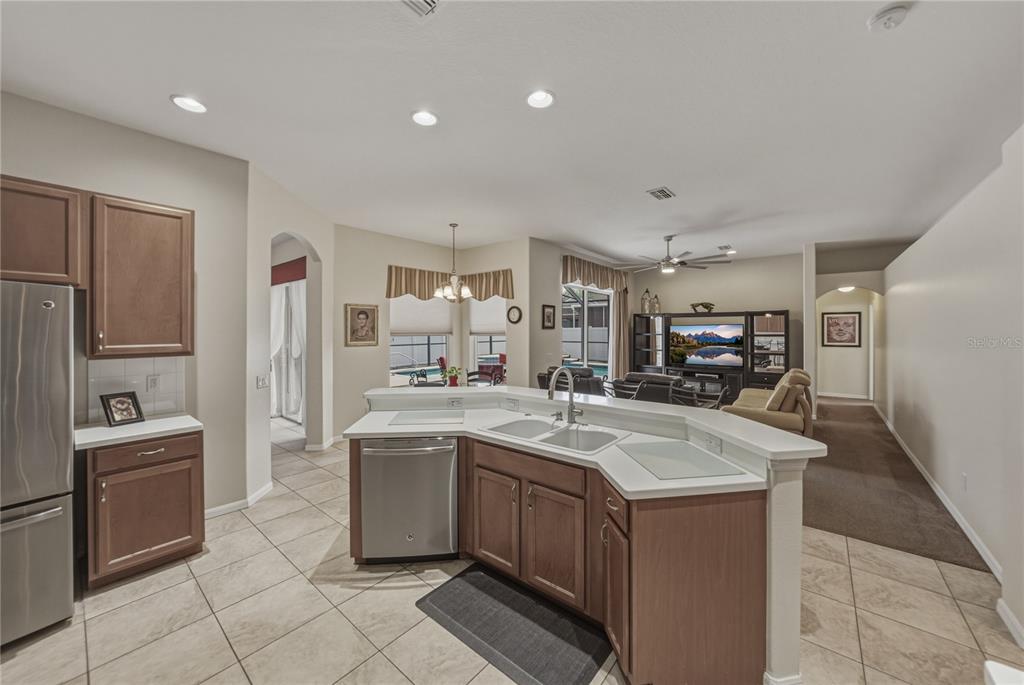 1542 Swamp Rose Lane Trinity, FL 34655 - Photo 28 of 64 a kitchen with a sink stove and refrigerator