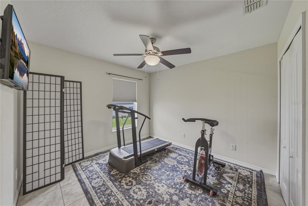 1542 Swamp Rose Lane Trinity, FL 34655 - Photo 49 of 64 a very nice looking room with a rug