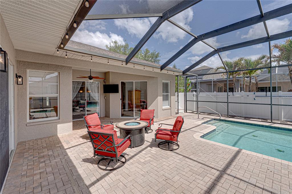 1542 Swamp Rose Lane Trinity, FL 34655 - Photo 57 of 64 a outdoor space with lots of furniture and garden view