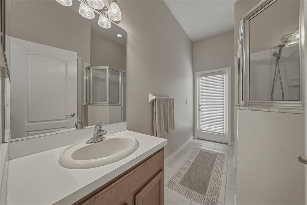 1542 Swamp Rose Lane Trinity, FL 34655 - Photo 6 of 64 a bathroom with a sink and a mirror