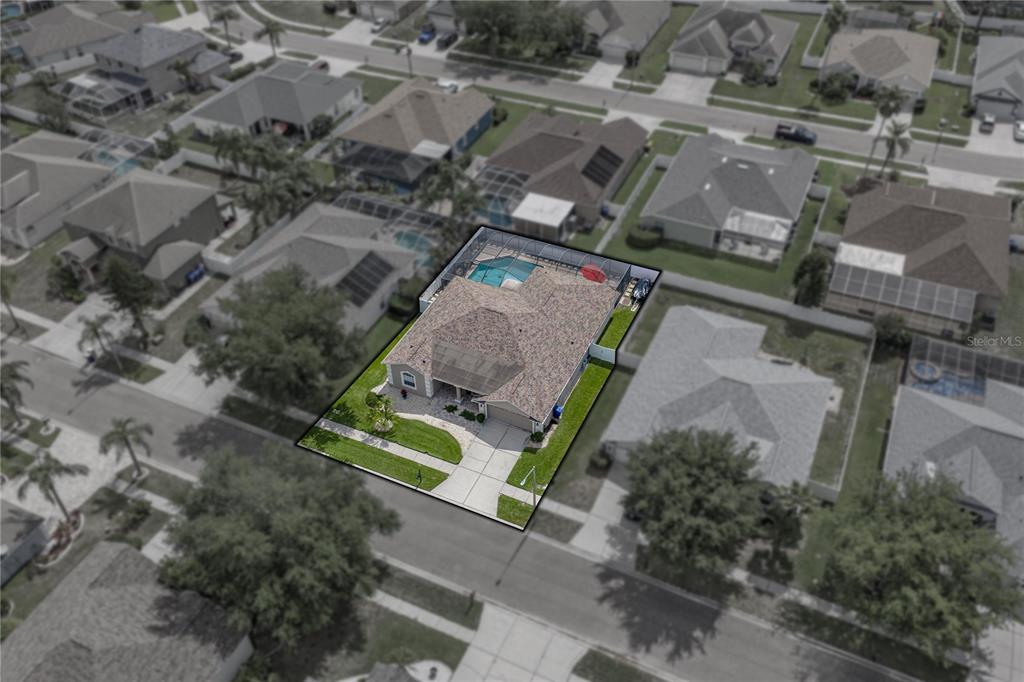 1542 Swamp Rose Lane Trinity, FL 34655 - Photo 64 of 64 an aerial view of a house with a yard