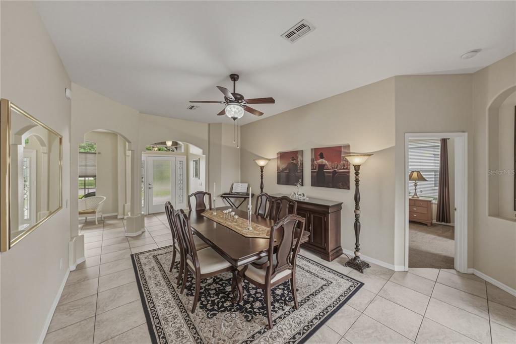 1542 Swamp Rose Lane Trinity, FL 34655 - Photo 8 of 64 a view of a livingroom with furniture and a dining table