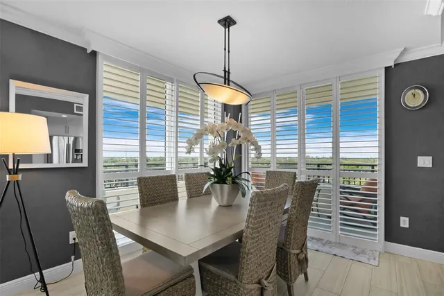 a dining room with furniture and window