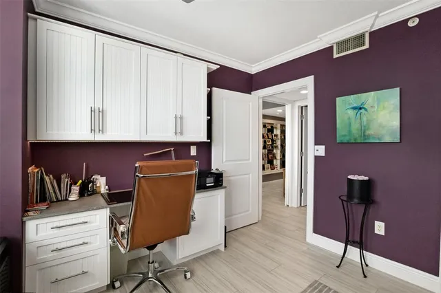 a view of workspace with wooden floor lounge chair and windows