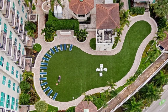 an aerial view of a city with parking