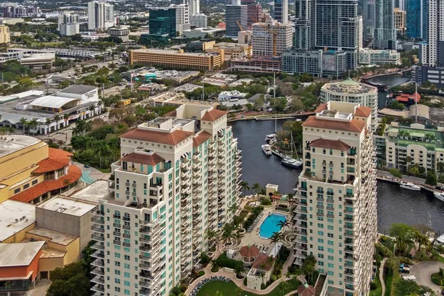 an aerial view of a swimming pool patio and outdoor seating