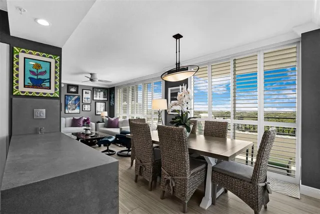 a view of a dining room with furniture window and wooden floor
