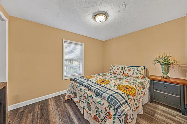 a bedroom with a bed and a dresser