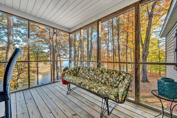 a bed sitting in a bedroom next to a large window
