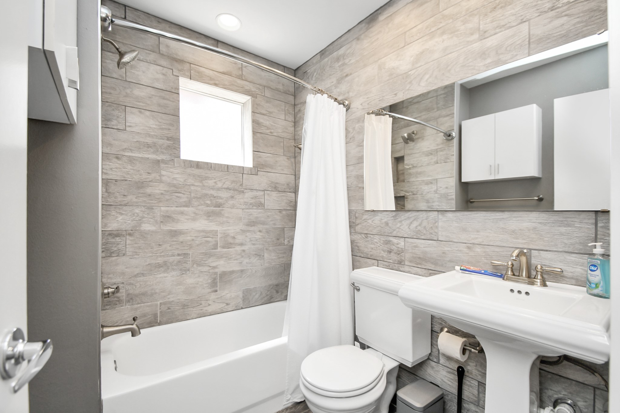 1806 Drew Street Houston, TX 77004 - Photo 13 of 17 a bathroom with a sink toilet and shower