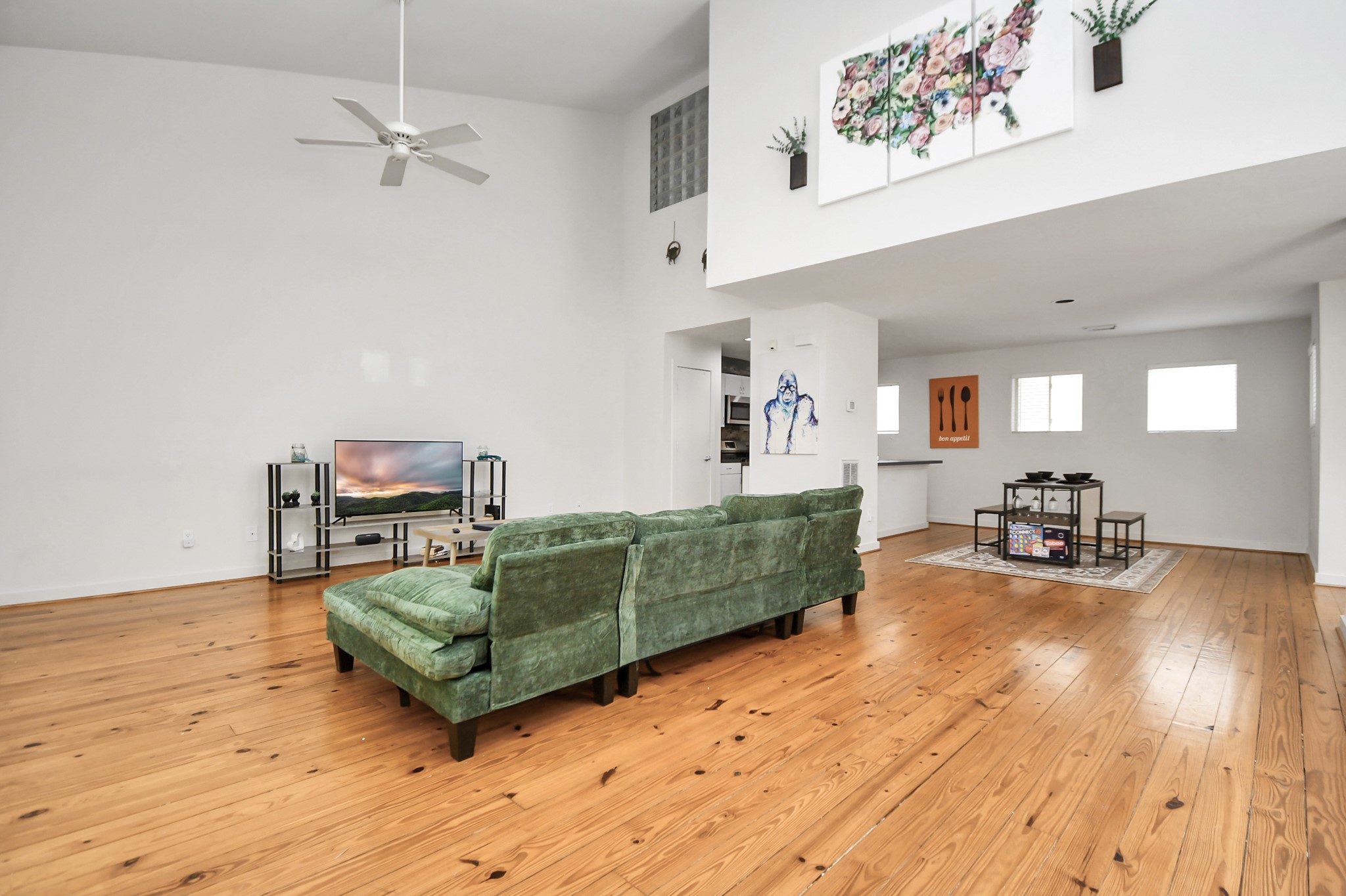 1806 Drew Street Houston, TX 77004 - Photo 3 of 17 a living room with furniture and a wooden floor