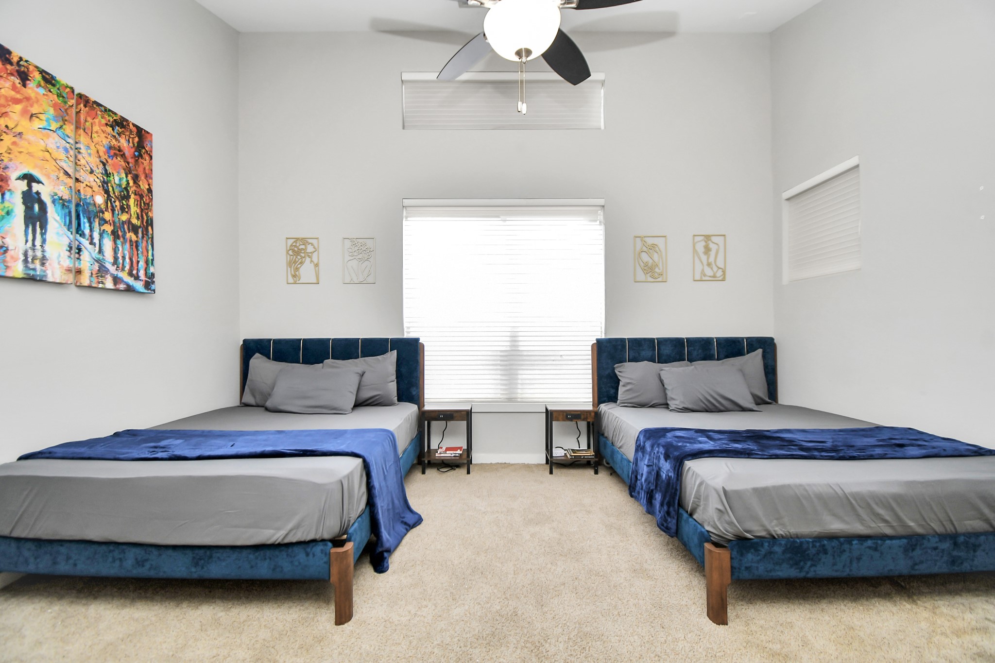 1806 Drew Street Houston, TX 77004 - Photo 9 of 17 a bedroom with a bed lamp and a chandelier