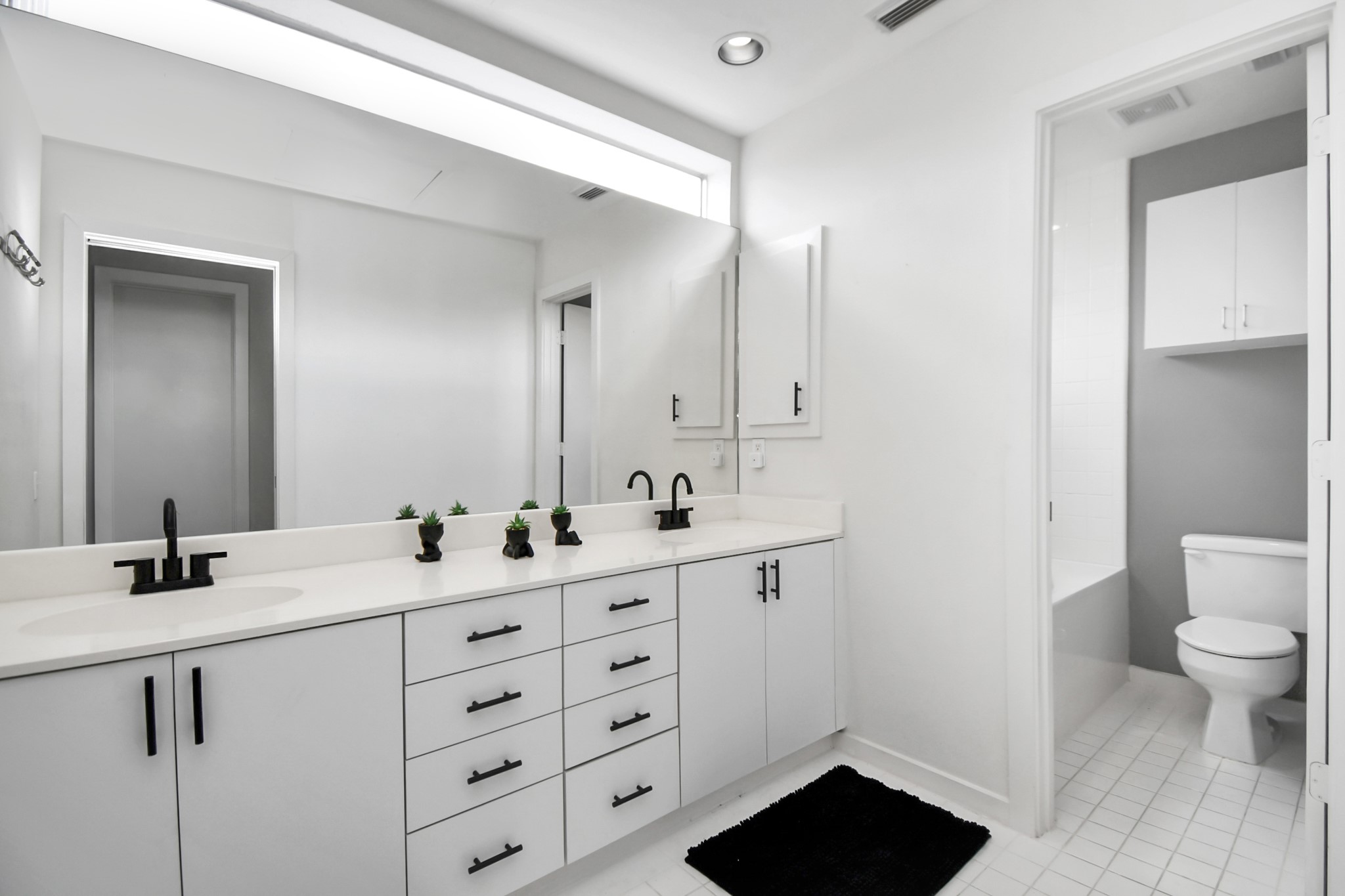 1806 Drew Street Houston, TX 77004 - Photo 10 of 17 a bathroom with a toilet sink and mirror